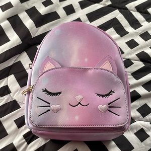 Cute purple backpack purse.